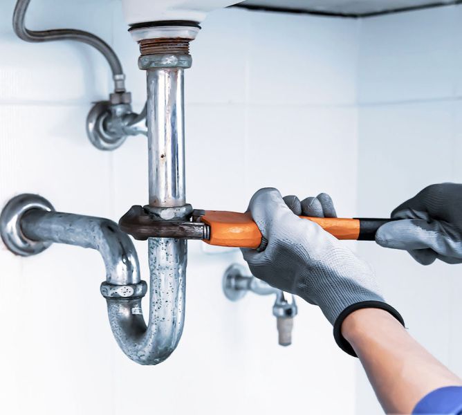 John G. Plumbing plumber fixing sink